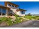 Inviting front entrance with well-maintained landscaping and contemporary architectural features at 8611 Coachlight Way, Littleton, CO 80125