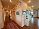 Spacious hallway with elegant hardwood floors and contemporary artwork at 8611 Coachlight Way, Littleton, CO 80125