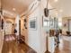 Hallway with wood floors and stylish artwork, creating an inviting path to various living spaces at 8611 Coachlight Way, Littleton, CO 80125