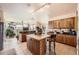 Spacious kitchen with a central island, ample cabinet space, and open layout at 8611 Coachlight Way, Littleton, CO 80125