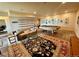 Spacious living room with a couch, coffee table, pool table, and lots of pictures on the walls at 8611 Coachlight Way, Littleton, CO 80125