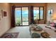 Bedroom with sliding doors that leads to a balcony that overlooks mountain and valley views at 8611 Coachlight Way, Littleton, CO 80125