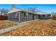Charming single-story brick home with well-maintained landscaping and a concrete walkway leading to the front door at 1010 S Osceola St, Denver, CO 80219