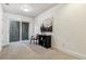 Finished basement with a sliding door and exterior access to the outdoor space at 409 Terry St # D, Longmont, CO 80501