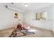Bright bedroom featuring a teepee and carpeted floors, perfect for a play area at 409 Terry St # D, Longmont, CO 80501