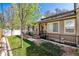 Well-maintained front yard featuring lush green grass and fresh landscaping at 409 Terry St # D, Longmont, CO 80501
