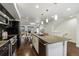 Modern kitchen with granite counters, island, stainless steel appliances, and open floor plan at 409 Terry St # D, Longmont, CO 80501