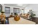 Cozy living room with neutral color palette, comfortable seating, woven shades and hardwood floors at 409 Terry St # D, Longmont, CO 80501