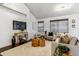 Bright living room featuring stylish seating, area rug, contemporary decor, and natural light at 409 Terry St # D, Longmont, CO 80501
