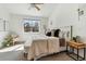 Bright bedroom with large window, plush carpet, and stylish neutral decor at 409 Terry St # D, Longmont, CO 80501
