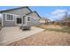 Spacious backyard with a patio and seating area, perfect for outdoor relaxation at 9080 Fig St, Arvada, CO 80005