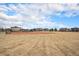 Community baseball field with a well-maintained infield, grassy outfield, and walking paths at 9080 Fig St, Arvada, CO 80005