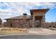 Community clubhouse featuring stone accents, neutral colors, and an inviting entrance at 9080 Fig St, Arvada, CO 80005