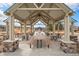 Community pavilion with picnic tables, stone supports, and a view of the surrounding area at 9080 Fig St, Arvada, CO 80005