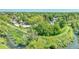 The walking trail leads to a wooded area with mature trees and a nearby creek at 8032 Lee Ct, Arvada, CO 80005