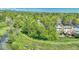 The walking trail leads to a serene setting near a creek and beautiful mountain views in the distance at 8032 Lee Ct, Arvada, CO 80005