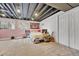 Spacious carpeted basement with natural light and exposed ceiling for modern aesthetic at 8032 Lee Ct, Arvada, CO 80005