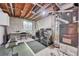 Unfinished basement featuring a laundry area, utilities, and exposed piping at 8032 Lee Ct, Arvada, CO 80005
