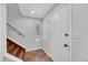 Bright entryway with tile floors, stairs, and white door at 8032 Lee Ct, Arvada, CO 80005
