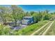 Charming two-story home featuring a well-manicured lawn and mature trees for added privacy and appeal at 8032 Lee Ct, Arvada, CO 80005