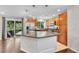 Open kitchen with granite countertops, stainless appliances, and sliding glass doors to a deck at 8032 Lee Ct, Arvada, CO 80005