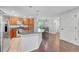 Open kitchen with granite island, stainless appliances, and dining area at 8032 Lee Ct, Arvada, CO 80005