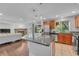 Spacious kitchen with stone countertops, stainless steel appliances and breakfast bar at 8032 Lee Ct, Arvada, CO 80005