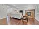 Comfortable living room with fireplace, wood floors and natural light at 8032 Lee Ct, Arvada, CO 80005