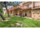 Townhome backyard with a well-maintained lawn and private deck, perfect for relaxing at 338 Pheasant Run, Louisville, CO 80027