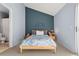 Charming bedroom with sloped wall, standard size bed, and carpeted floors at 338 Pheasant Run, Louisville, CO 80027