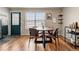 Bright dining area features a window view, stylish table set, and modern decor at 338 Pheasant Run, Louisville, CO 80027