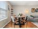 Cozy dining area featuring natural light, stylish seating, and warm lighting at 338 Pheasant Run, Louisville, CO 80027