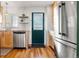 Modern kitchen with stainless steel appliances, granite countertops and sleek design at 338 Pheasant Run, Louisville, CO 80027