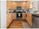 Well-lit kitchen with modern appliances, ample cabinetry, and stylish countertops at 338 Pheasant Run, Louisville, CO 80027