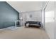 Home office features a desk, a futon, and two windows for plenty of natural light at 338 Pheasant Run, Louisville, CO 80027