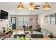 Cozy living room featuring an open layout, stylish decor, and ample natural light at 338 Pheasant Run, Louisville, CO 80027
