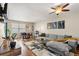 Comfortable living room featuring a gray couch, colorful rug, and modern decorations at 338 Pheasant Run, Louisville, CO 80027
