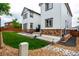 Beautiful backyard with green grass, landscaping, and a concrete patio, great for entertaining at 690 W 172Nd Pl, Broomfield, CO 80023