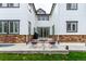 Backyard patio with seating, table, and a sliding glass door, perfect for outdoor living at 690 W 172Nd Pl, Broomfield, CO 80023