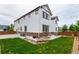The backyard has a well-maintained lawn and stone accents, offering a private outdoor space at 690 W 172Nd Pl, Broomfield, CO 80023