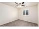 Bright bedroom with neutral walls, carpet flooring, a ceiling fan and window with plantation shutters at 690 W 172Nd Pl, Broomfield, CO 80023