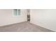 Neutral room with wall to wall carpeting, white walls, and a window with shutters at 690 W 172Nd Pl, Broomfield, CO 80023