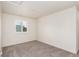 Neutral bedroom with wall to wall carpeting, white walls, and a window with shutters at 690 W 172Nd Pl, Broomfield, CO 80023