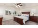 Serene main bedroom with a large bed, side tables, and large bright windows at 690 W 172Nd Pl, Broomfield, CO 80023