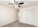 Bright bedroom featuring neutral walls, carpet flooring and a closet with bi-fold doors at 690 W 172Nd Pl, Broomfield, CO 80023
