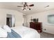 Spacious bedroom featuring a ceiling fan with light fixture, a dresser with decor, and neutral colored walls at 690 W 172Nd Pl, Broomfield, CO 80023