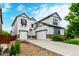 Charming two-story home features a two-car garage, stone accents, and a well-manicured lawn and driveway at 690 W 172Nd Pl, Broomfield, CO 80023