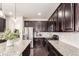 Modern kitchen boasting stainless steel appliances, granite countertops, and ample cabinet space at 690 W 172Nd Pl, Broomfield, CO 80023