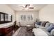 Inviting living room features a comfortable sofa, ceiling fan, plantation shutters, and a decorative rug at 690 W 172Nd Pl, Broomfield, CO 80023