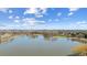 Scenic aerial view of Huston Lake Park, showcasing the lake and surrounding greenery at 1299 S Dale Ct, Denver, CO 80219